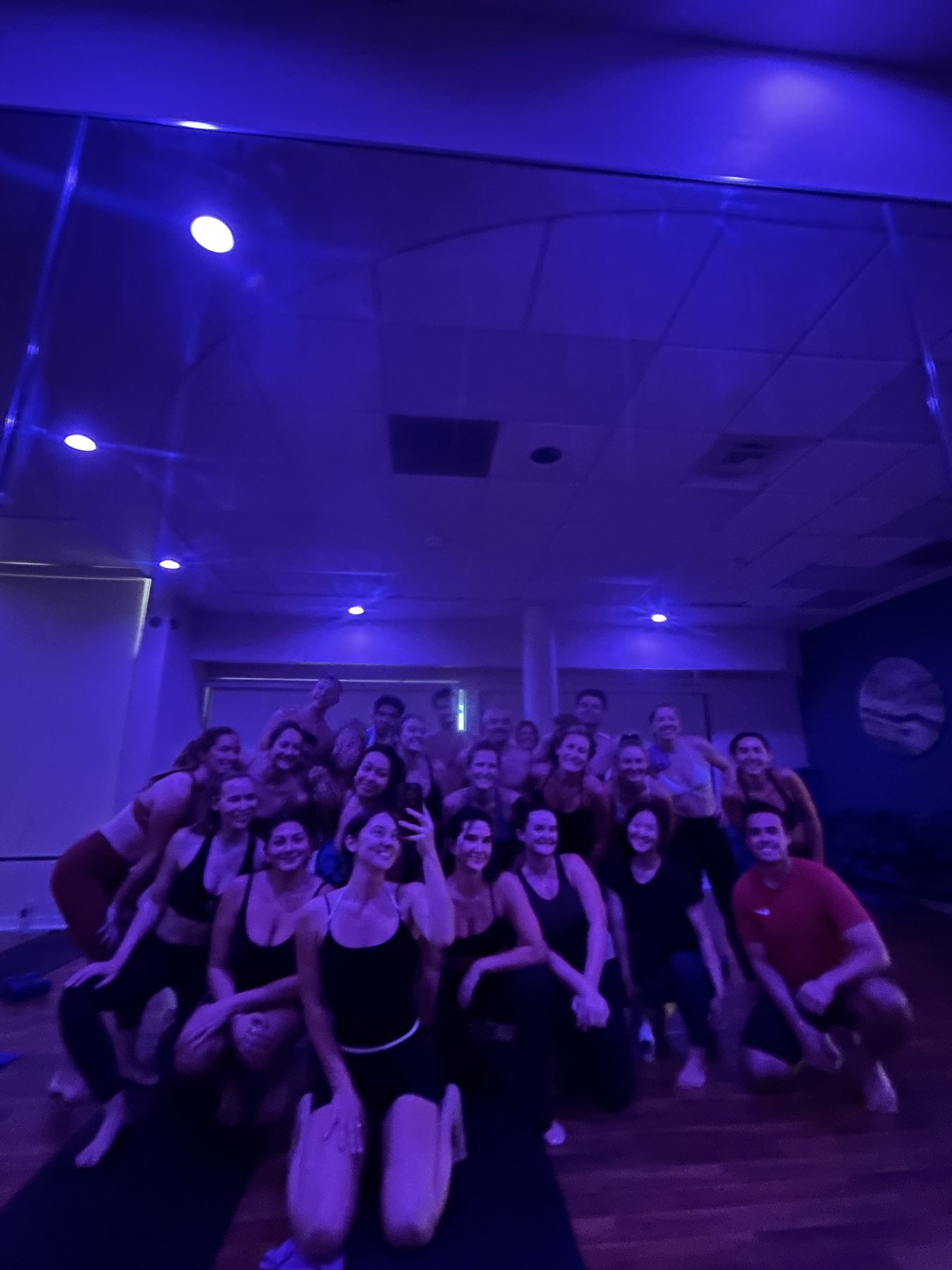 Group fitness class posing together after a session